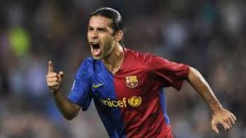 Rafa Márquez: Soccer player in red and blue runs on the field