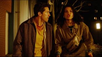 Reckless: A man and woman walk urgently at night, looking concerned