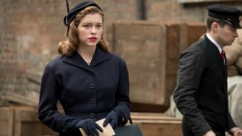 Red Joan Movie: Joan looks pensive as she stands on a street holding an envelope