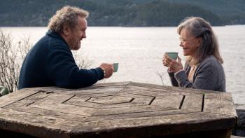 Remarkably Bright Creatures: Colm Meaney and Sally Field at a lakeside picnic table.