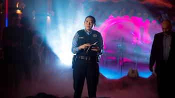 Renfield Movie: Police officer Rebecca Quincy (Awkwafina) examines a crime scene