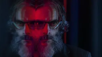 Rest in Peace movie: Argentinian bearded man in sunglasses has red mirror reflection of his face creating two images of him