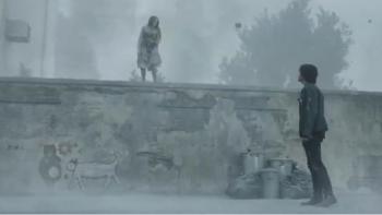 Return to Silent Hill Movie: Young Laura (Evie Templeton) stands on top of a gray wall and speaks to James below