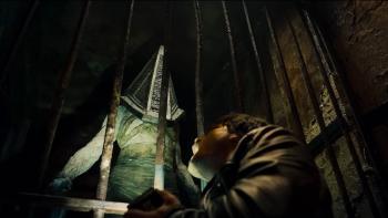 Return to Silent Hill Movie: Red Pyramid appears behind a barred door, while James crouches in terror and agony below