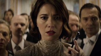 Rich Flu: Woman in a sparkly dress holds a phone, surrounded by concerned people in formal attire