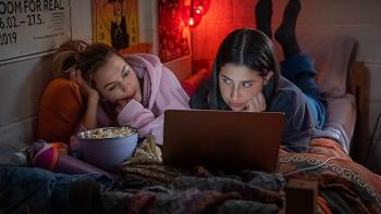 Roommates: Chloe East and Sadie Sandler watch TV.