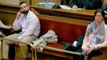 Rosa Peral's Tapes Scene 2: A man and a woman sit with a big space between each other on a bench