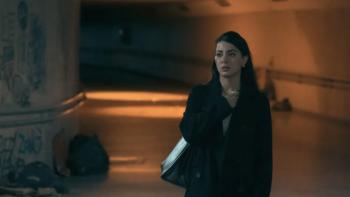 Rosario movie: Rosario is standing in what looks like a dimly lit hallway or corridor