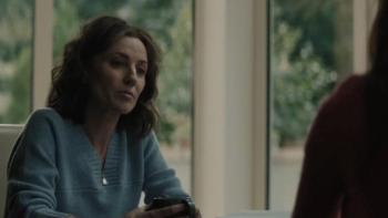 Rose Plays Julie: Woman looks to another character to the right.