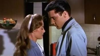 Roustabout: Joan Freeman and Elvis Presley stand face to face in a kitchen