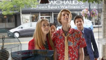 Rufus 2: A young White girl and boy stare into a shop window, with another boy and girl standing behind them