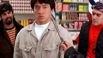 Rumble in the Bronx Movie: Jackie Chan surrounded by rough-looking guys