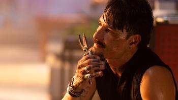 Runner movie: Rodrigo Santoro holds a knife under his chin