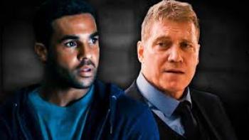Safe House Movie: Black man in hoodie and White man in suit