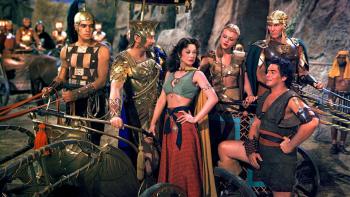 Samson and Delilah: A woman and man stand proudly at a chariot, surrounded by soldiers