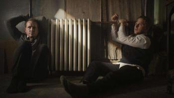 The Saratov Approach Movie: Tuttle (Corbin Allred, left) and Propst (Maclain Nelson) and are tied to a radiator by their hands