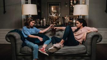 Satanic Panic Movie: Sam and Judi share a drink on the couch