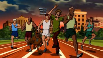 Scooby-Doo! Spooky Games: Scooby-Doo and Shaggy speed past runners on a track