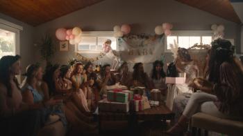 Scrambled Movie: Group of women wearing flower crowns sitting in a circle at a baby shower