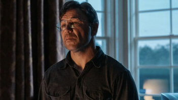 Heel: Stephen Graham, wearing glasses, looks serious