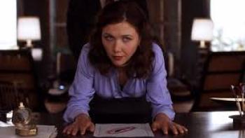 Secretary: Maggie Gyllenhaal at work