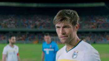 See You Soon Movie: Ryan grins as he readies to kick a goal