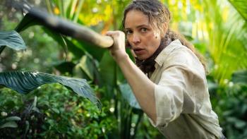 Send Help Movie: Linda, holding a sharpened tree branch at the ready, hunts for a wild boar in the jungle