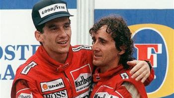 Senna: Ayrton Senna and Alain Prost hug on a podium, both wearing red racing suits