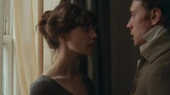 Sense and Sensibility: A young woman and a man stare into each others eyes intensely, near a curtained window