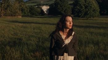 Sense and Sensibility: A young woman walks through a field, a country estate behind her