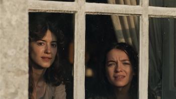 Sense and Sensibility: Two young women looking out a window, appearing curious and concerned