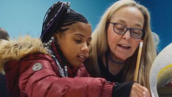 Sentenced: A literacy volunteer tutors a child.