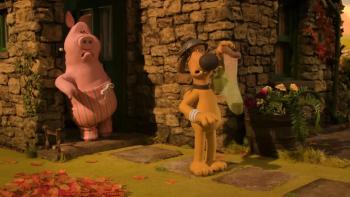 Shaun the Sheep—The Beast of Mossy Bottom: A dog holds a sock, while a pig watches from a stone house doorway, surrounded by autumn leaves