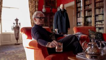 Shelter movie: Bill Nighy sits in an elegant home library with Jason Statham standing nearby