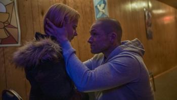 She Rides Shotgun Movie: Polly looks downcast as her father kneels and gently cradles her head in his hands