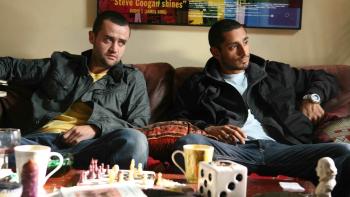 Shifty: A young White male and a young Asian male sit on a couch during a drug deal