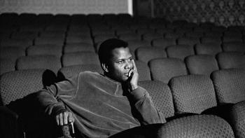 Sidney Movie: Sidney Poitier sitting in a movie theater