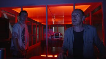 Signal One movie: Josh Hutcherson and David Thewlis analyze the signal device in a red-lit room