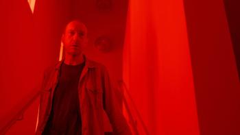 Signal One movie: David Thewlis walks down a red-lit stairwell
