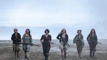 Sisu Movie: Aino (third from left), a freed female prisoner of the Nazis, marches while holding a rifle, flanked by five other women, all also holding