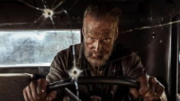 Sisu: Road to Revenge Movie: Seen through a bullet-hole-riddled windshield, Aatami Korpi (Jorma Tommila) drives furiously