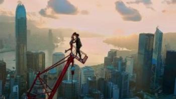 Skywalkers: A Love Story: Two figures atop a building.