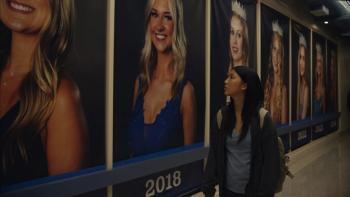 Slanted movie: Shirley Chen walks down a hallway that's lined with past prom queens