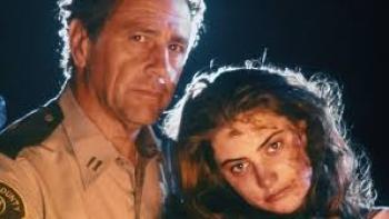 Sleepwalkers Movie: Bloodied young woman with officer