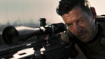 Sniper—No Nation: A White men looks down his rifle sight ready to take a shot