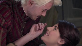 Snow White's Christmas adventure: The prince leans over a newly awakened princess.