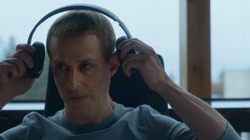 The Social Reckoning movie: Mark Zuckerberg (Jeremy Strong) puts headphones on