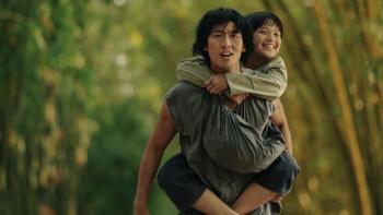 Song of the South: Tuan Tran carries Huynh Hao Khang on his back.