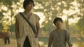 Song of the South: Tuan Tran and Huynh Hao Khang walk through the woods.