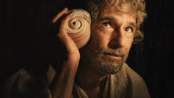 The Son of a Thousand Men Movie: Rodrigo Santoro holds seashell to ear